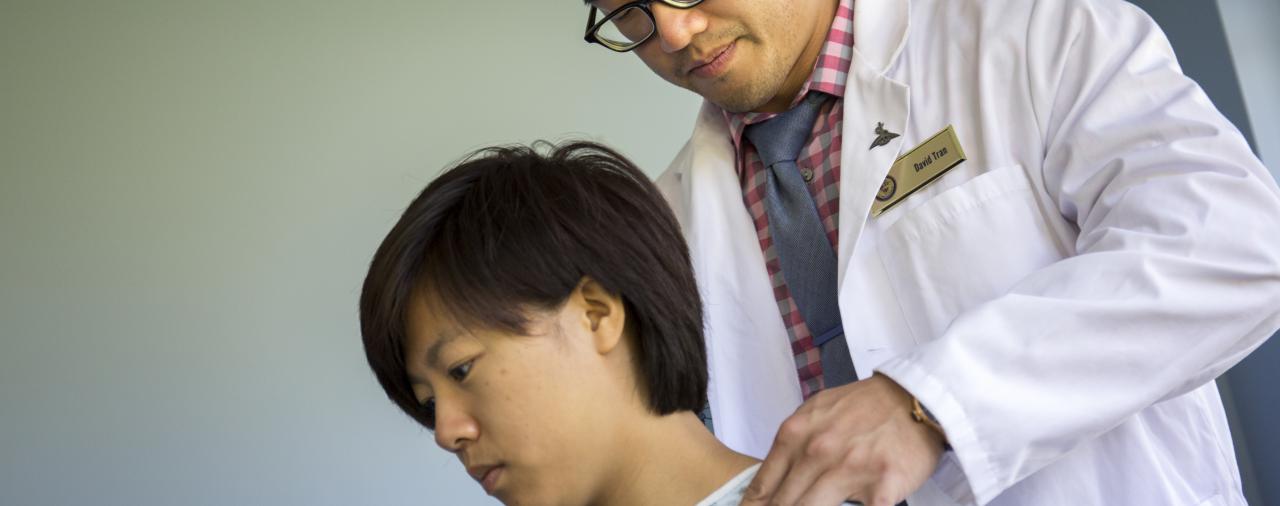 A man performing a chiropractic manipulation