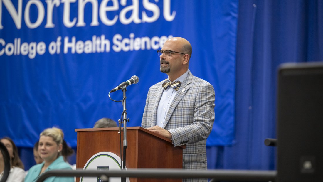 Dr. Mestan speaking at Transitions Cermony