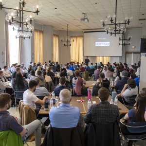 image of the crowd watching Dr. Kollmann