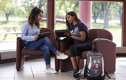 Two students sitting at a table