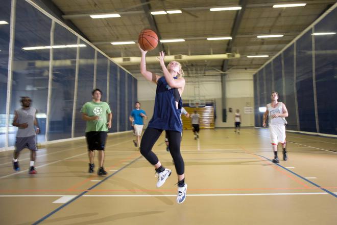 Students playing the sport of basketball
