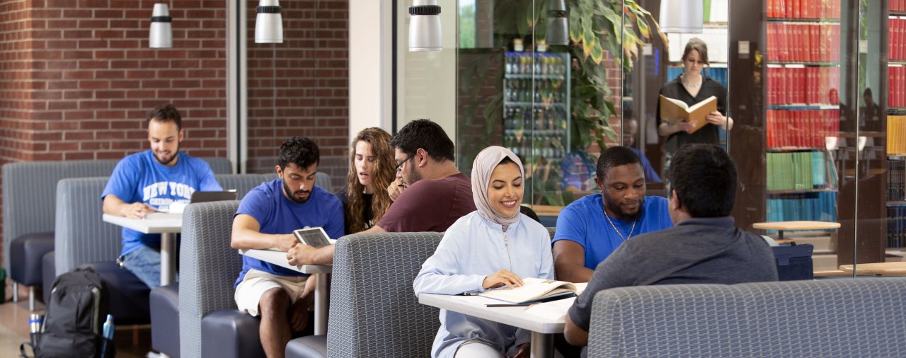 groups of students working together in the Library commons area