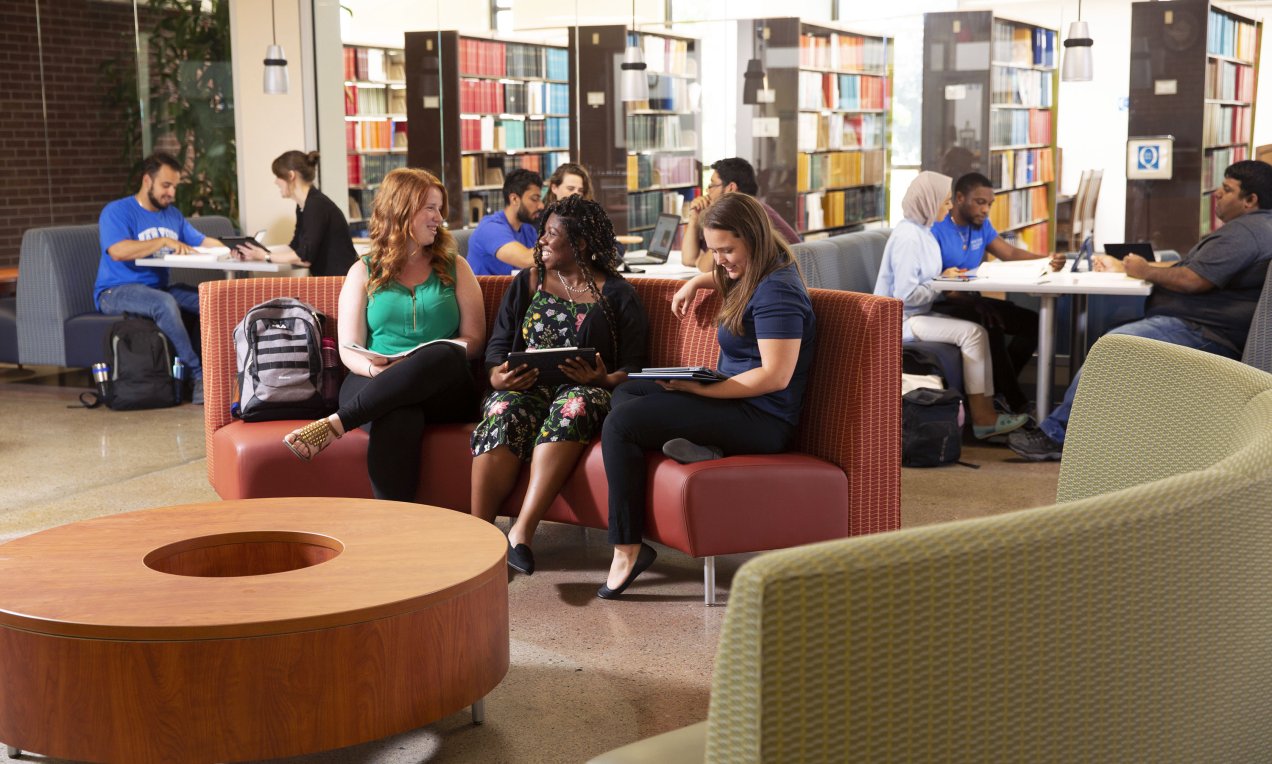 students in the commons area of the library