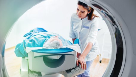 a radiologic technologist works with a patient