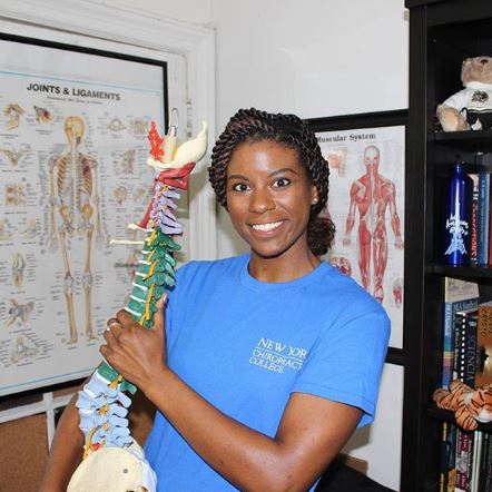 Ashley Williams holding a replica spine