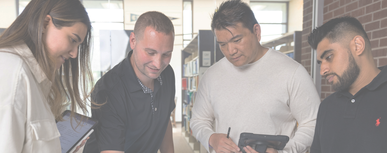 a group of students receiving instruction from a Northeast faculty member