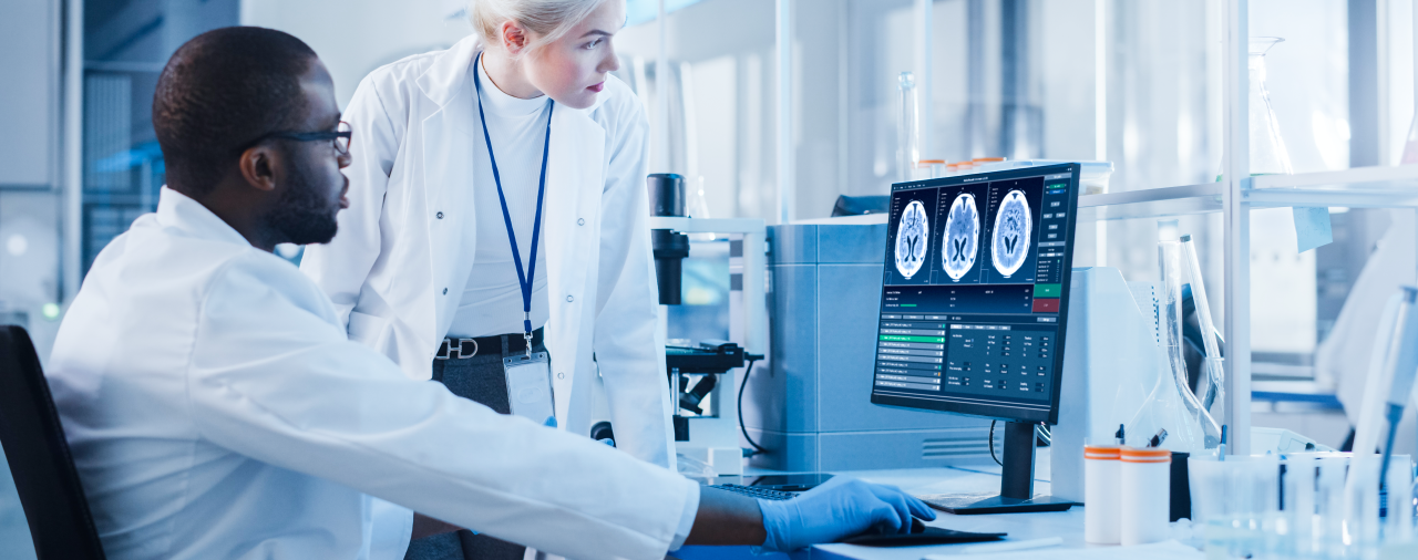 a radiologic technologist reviewing X-rays with a medical team member